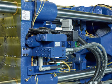 Two integrated hydraulic core puller inter faceare fixed on the moving platen and provide more flow and an increased pressure compared to external power pack solutions. Pressure andflow are adjustable on the control